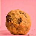 Choco chunk cookie classic American cookie with sea salt topping and soft gooey center brown butter on pink background photography.