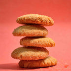 Coconut biscuit cookies crispy texture covered in coconut with Pink background stacked on top of each other professional product photography