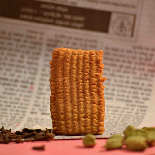 Traditional style India biscuit made with whole wheat flour, Atta biscuit online with newspaper as background professional product photography